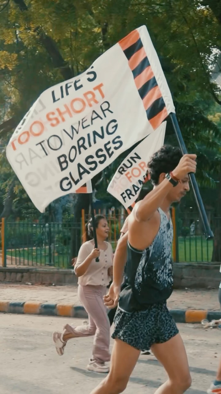 Runners carrying Run for Frame flags